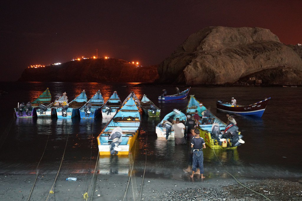 Yemeni fishing boats at night, symbolizing coastal livelihoods